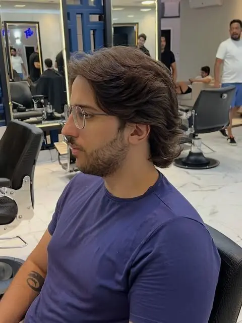 Cliente com cabelo ondulado finalizado na Lottus